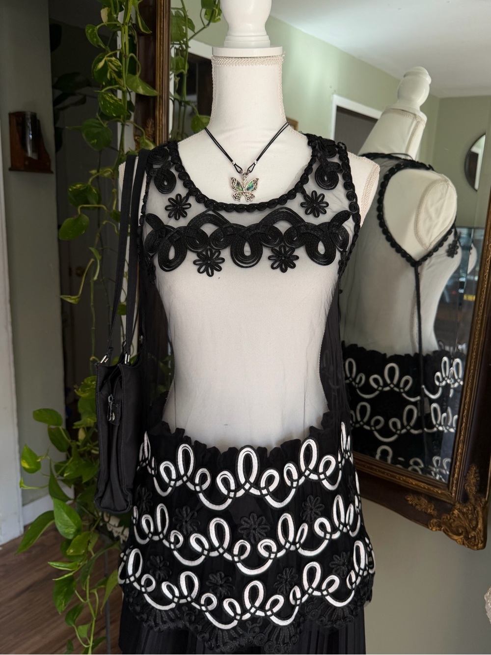 Somya brand Black whimsy lace top with white scrollwork embroidery